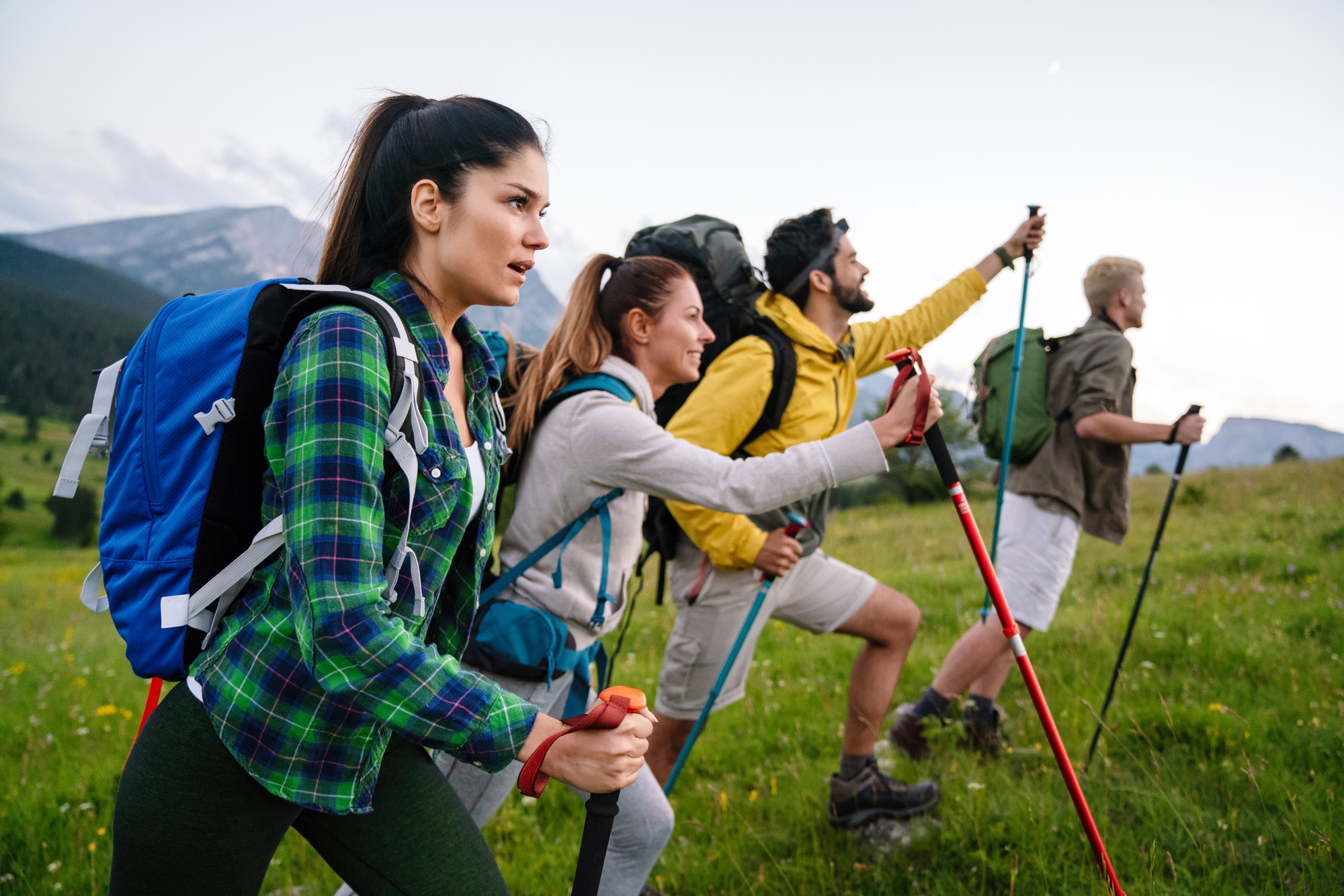 group-of-friends-trekking-with-backpacks-walking-in-the-forest-1.jpg