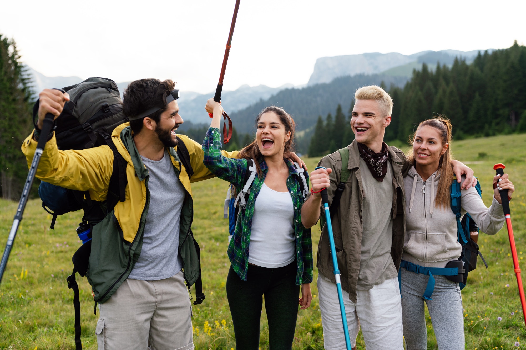 group-of-friends-trekking-with-backpacks-walking-in-the-forest.jpg